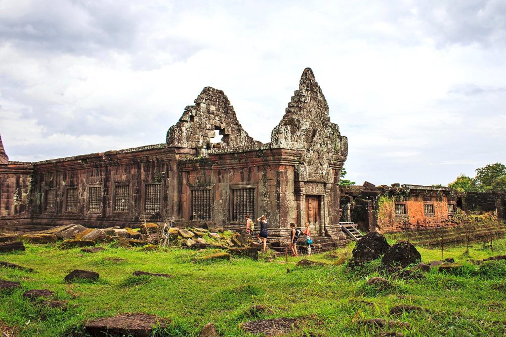 A scenic view of Champasack Province in Laos, showcasing the lush landscape, Mekong River confluence, and traditional architecture of Pakse.